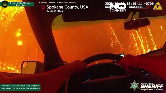 Video: Spektakuläre Aufnahmen: Polizist flieht vor lodernden Flammen im Spokane County