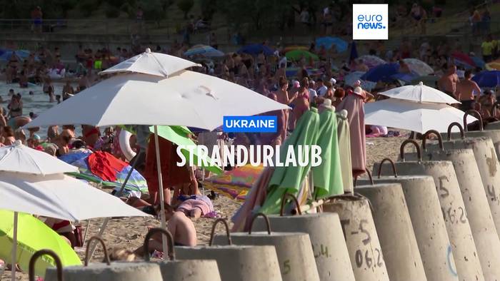 Video: Strandpartie zwischen Betonsperren und Bombardements